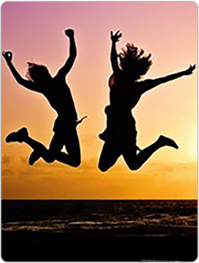 Women jumping in sunset